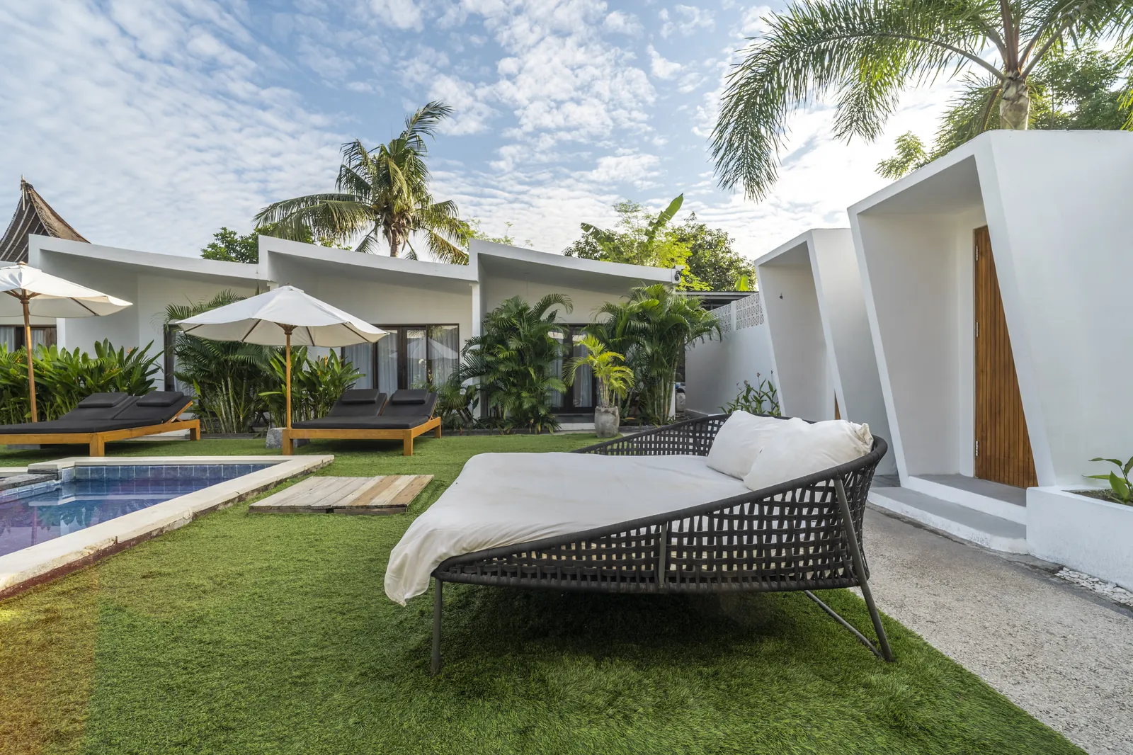 A quiet daybed beside the pool — a favourite remote-working spot at JAGO